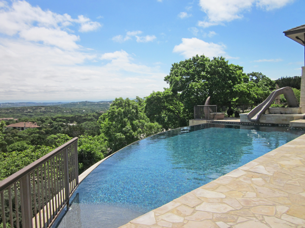 A home's infinity pool view high on a hill