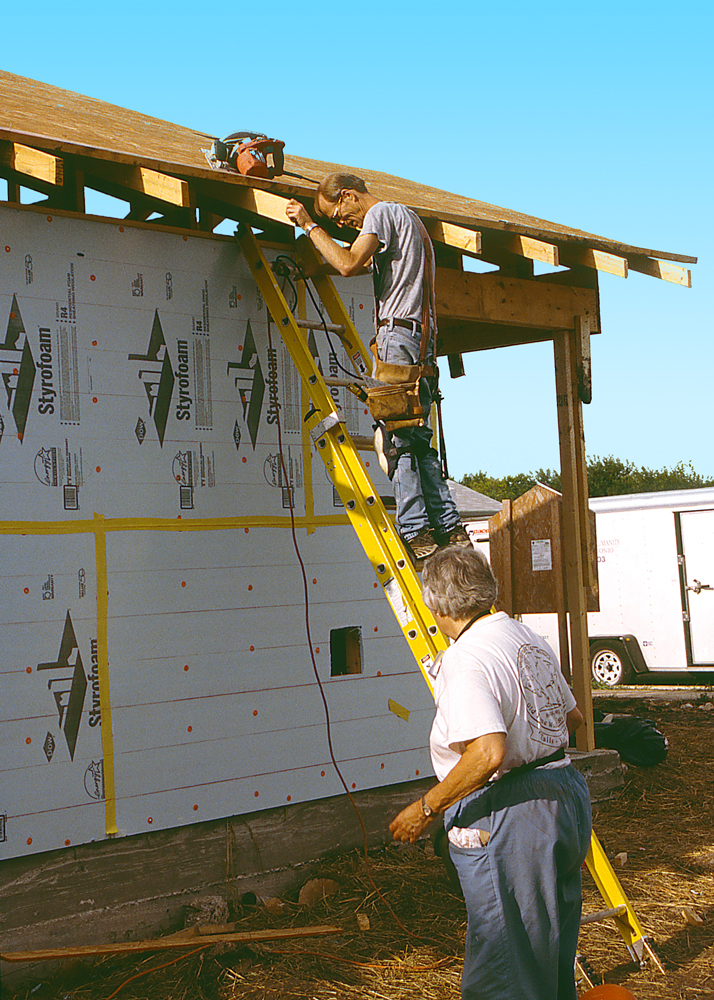 Volunteers working on a house